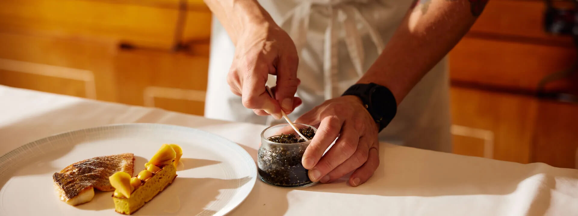 Chef plating a dish